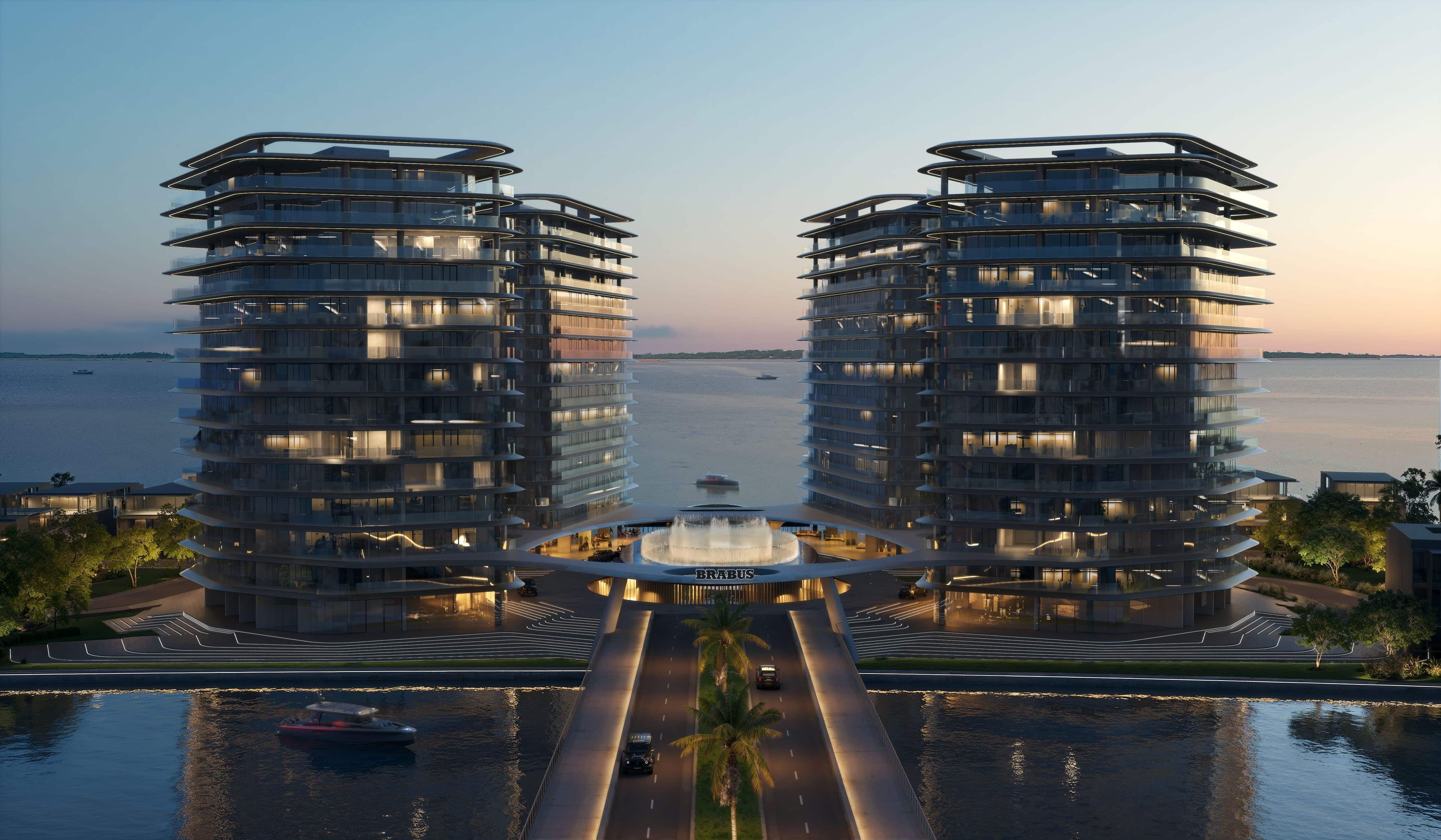 Modern luxury waterfront towers at dusk with a central fountain and bridge entrance.