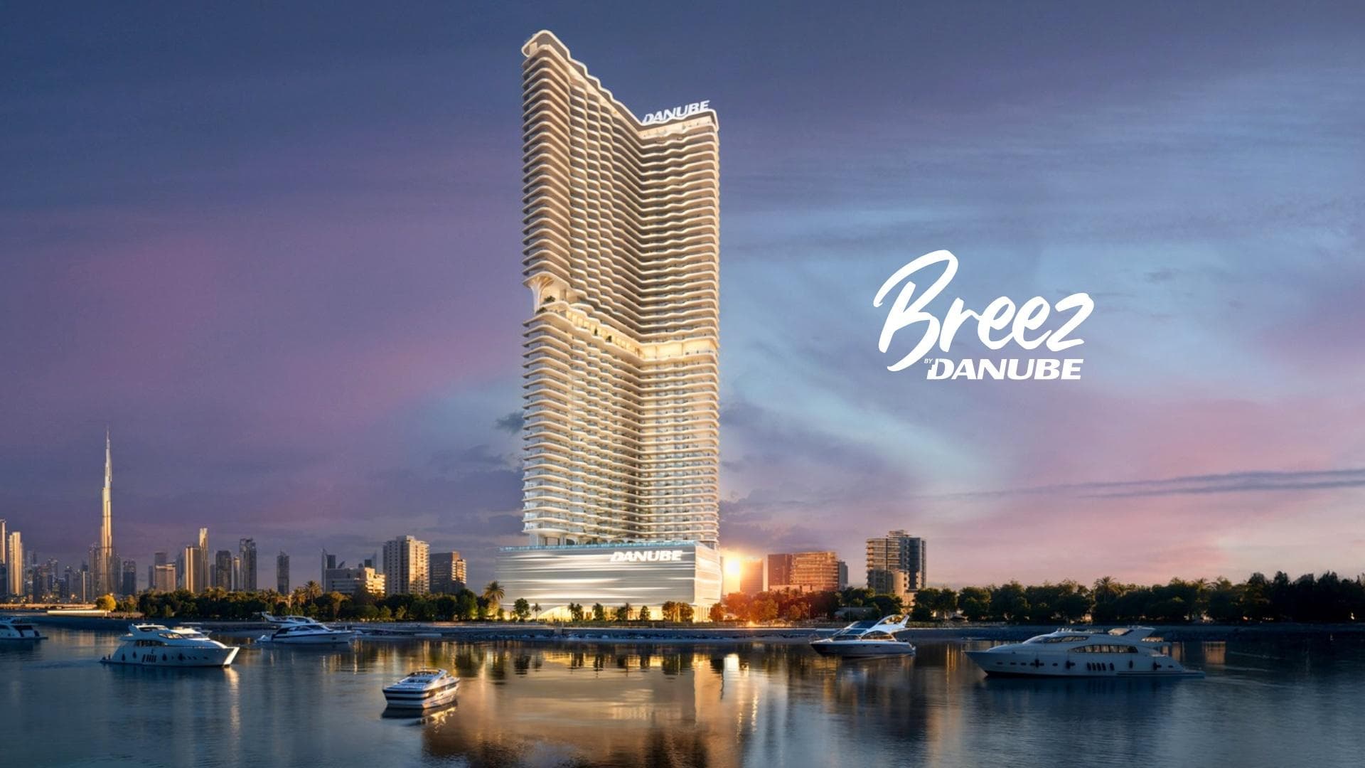 Tall, wavy Breez by Danube skyscraper overlooking a harbor with yachts at sunset in Dubai.